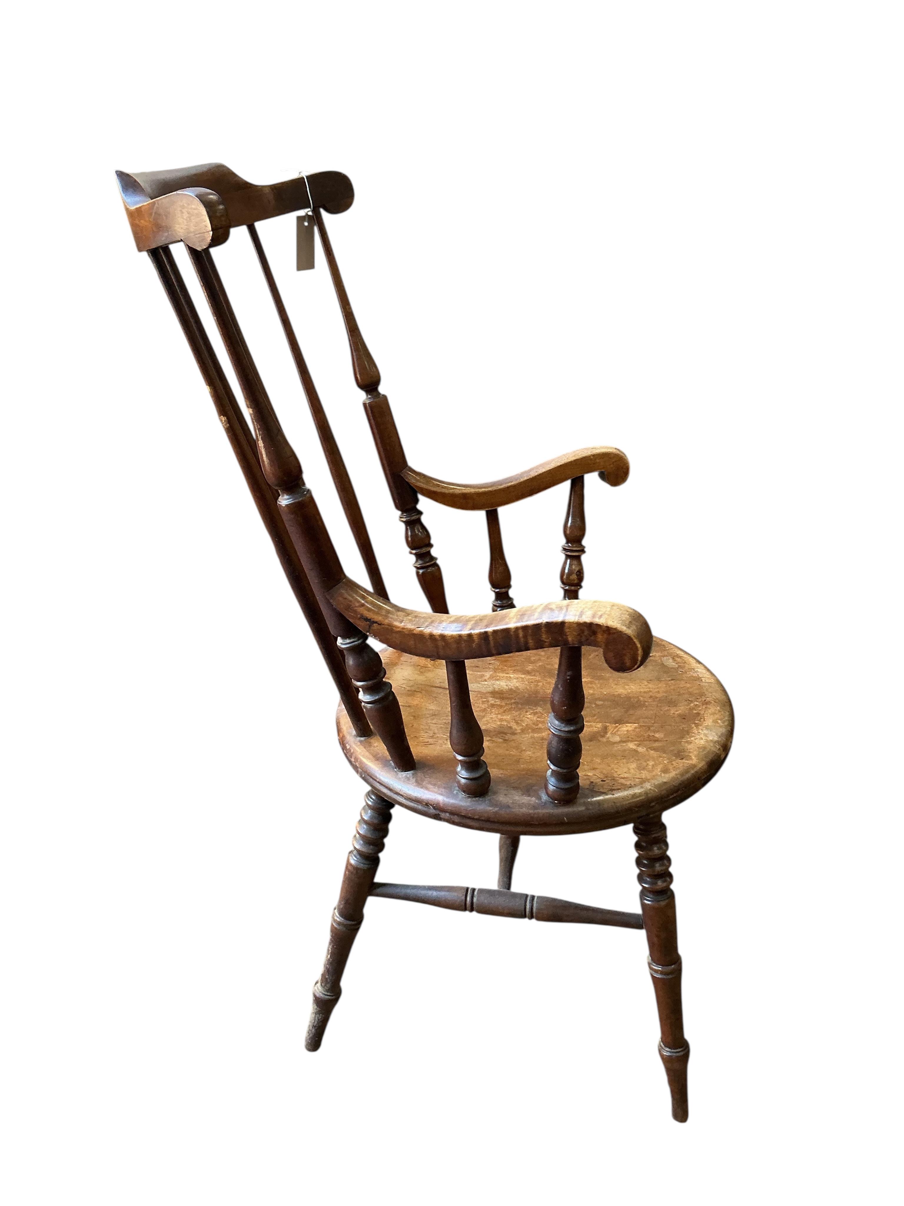 An early 20th century Windsor beech armchair, width 61cm, depth 52cm, height 110cm